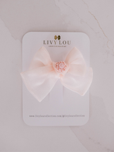 Load image into Gallery viewer, Pink bow hair accessory on a branded card with 'LIVY LOU' on a light gray background