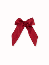Load image into Gallery viewer, Red bow on a white background
