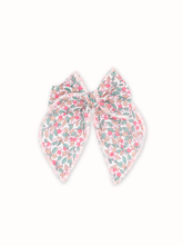 Load image into Gallery viewer, Pair of floral patterned earrings on a white background
